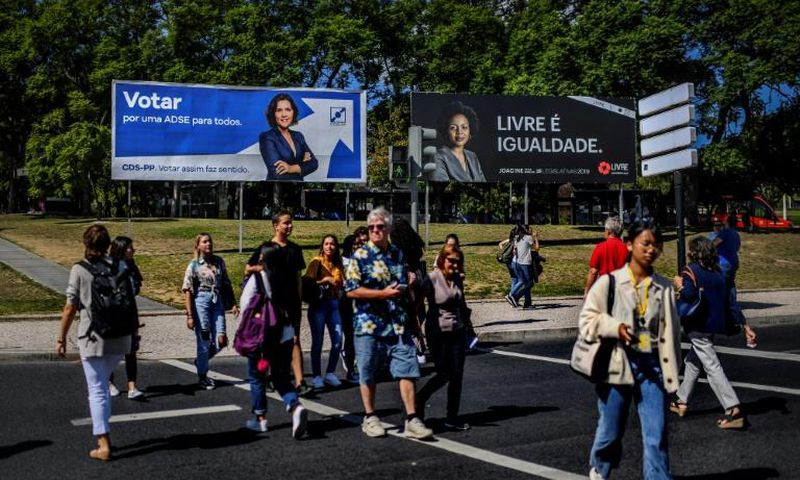 Anti-racism activist Joacine Katar Moreira, seen on the billboard on the right, is the best-known of the three new lawmakers