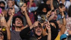 People bang pans and pots at a concert in support of the strike against President Ivan Duque's government in Medellin, Colombia on December 1, 2019