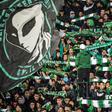 Supporters of Raja Club Athletic chant slogans and wave flags at a Moroccan football match between Raja and Mouloudia Oujda in January