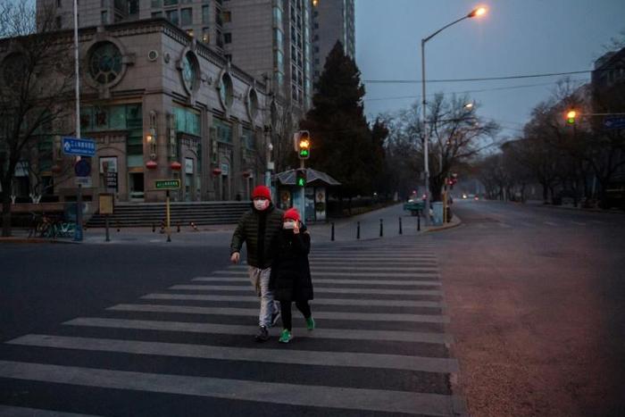 People in Beijing are donning masks and spraying antiseptic in a battle to halt the spread of the viral outbreak