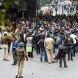 Students and their supporters face off against police outside the Jawaharlal Nehru University gate in New Delhi