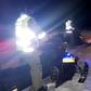 Police use snowmoblies during a search and rescue operations after a Canadian guide died and five French tourists went missing when their snowmobiles plunged through ice into the freezing water