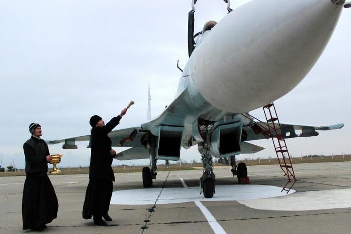 Blessing ships and aircraft such as this SU-27 SM fighter jet is believed to bestow divine protection