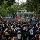 Hong Kong protesters march along a street during a demonstration against parallel trading in Sheung Shui, near the China border