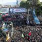 Iranian mourners gather around a vehicle carrying the coffin of slain top general Qasem Soleimani during the final stage of funeral processions, in his hometown Kerman