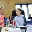 Greta Thunberg (R) calls the climate law championed by European Commission President Ursula von der Leyen (L) insufficient, or in her words, "surrender"
