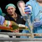 A supervisor looks on as workers empty bottles of the adulterated vodka in the town of Vynnyky, western Ukraine