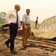 Australia's Prime Minister Scott Morrison (L) has faced sustained anger for his handling of the months-long bushfire crisis