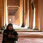 A woman prays in the main mosque in Srinagar after it opened for the first time in nearly five  months