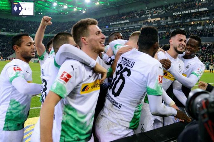 Remind me: Moenchengladbach's Algerian defender Ramy Bensebaini celebrates after converting the late penalty winner