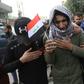An Iraqi youth cries during the funeral procession of a prominent civil society activist who was shot dead the previous night