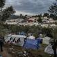 More than 18,000 asylum seekers are crammed into the Moria reception which was built to house 3,000