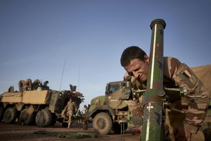 A French soldier of the French Army adjusts the coordinates of a mortar at a temporary base in northern Burkina Faso in November 2019