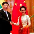 A scatalogical translation error in the name of Chinese President Xi Jinping (L) most notably appeared on the official Facebook page of Myanmar's civilian leader Aung San Suu Kyi (R)