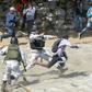 Mexican National Guards tackle migrants who   crossed the Suchiate River from Guatemala on January 20, 2020
