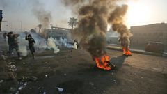 Anti-government protesters tried Monday to block central Baghdad streets with burning tyres