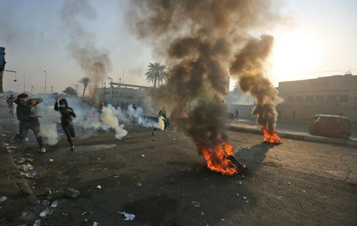 Anti-government protesters tried Monday to block central Baghdad streets with burning tyres