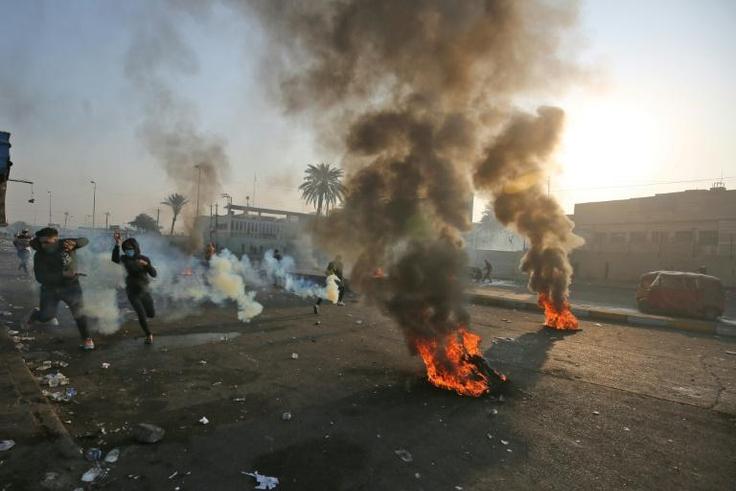 Anti-government protesters tried Monday to block central Baghdad streets with burning tyres