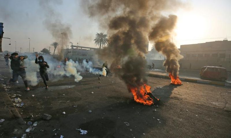 Anti-government protesters tried Monday to block central Baghdad streets with burning tyres
