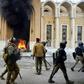 Smoke billows from a shrine in the Shiite holy city of Najaf dedicated to the late Ayatollah Mohammed Baqir al-Hakim, who founded one of Iraq's main Shiite political parties