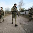 Ukrainian servicemen patrol in the streets of the village of Katerynivka, in the Lugansk region. The conflict in eastern Ukraine has been raging since 2014