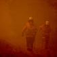 Towering bushfires in Australia have turned the sky red and forced thousands from their homes