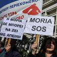 Dozens of demonstrators from the Aegean islands of Lesbos, Chios and Samos gathered outside the interior ministry, brandishing banners against the camps project