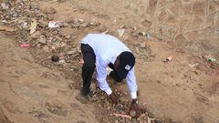 Former Kakamega Senator Bonny Khalwale collecting stones