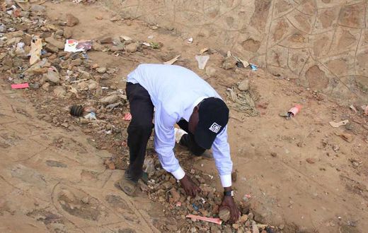 Former Kakamega Senator Bonny Khalwale collecting stones