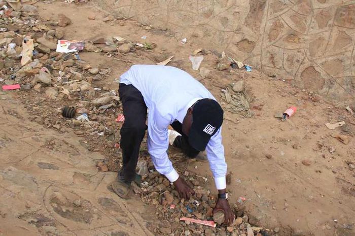 Former Kakamega Senator Bonny Khalwale collecting stones