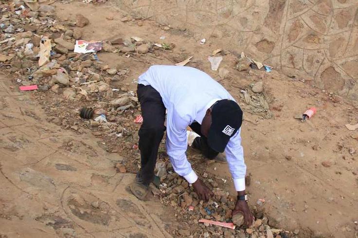 Former Kakamega Senator Bonny Khalwale collecting stones