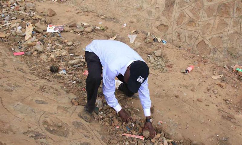 Former Kakamega Senator Bonny Khalwale collecting stones