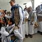 Yemeni Huthi prisoners were greeted upon their arrival at the airport of the capital Sanaa on Thursday, following their release by Saudi Arabia