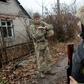Pondering with concern what concessions to Russia might be forced from their side in summit talks, Ukrainian servicemen patrol near the town of Avdiivka on the frontline with Russia-backed separatists