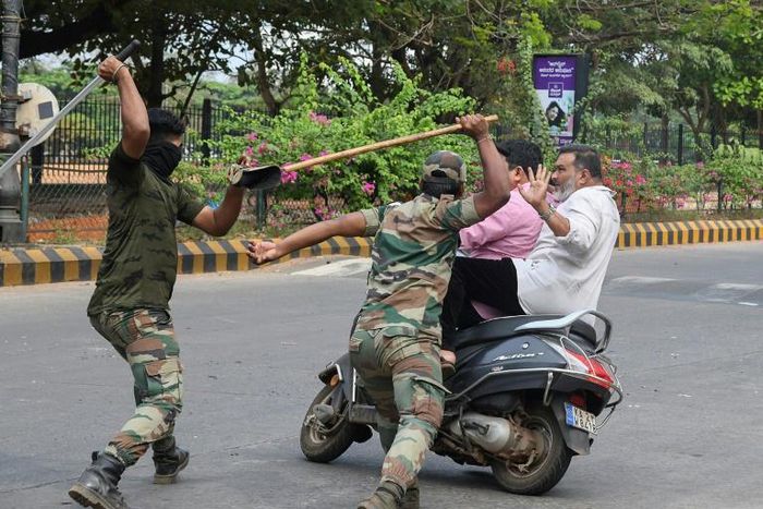 Hundreds have been injured in India during clashes between protesters and riot police wielding bamboo canes, or 'lathis'