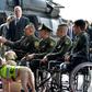 US Secretary of State Mike Pompeo (L) shakes hands with Colombian policemen victims of landmines during his visit at an anti-drug base in Bogota