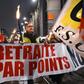 Protesters marched with torches in Strasbourg, eastern France, on Thursday against the French government's pension overhaul.