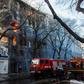 The blaze had been contained by Thursday morning, but dozens of firefighters were still combing through the partly destroyed walls of the six-storey building