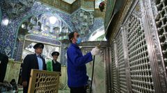 Iranian sanitary workers disinfect the Masumeh shrine in the Shiite holy city of Qom, where a prominent local member of parliament is among the latest people infected with the coronavirus