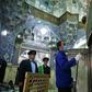 Iranian sanitary workers disinfect the Masumeh shrine in the Shiite holy city of Qom, where a prominent local member of parliament is among the latest people infected with the coronavirus