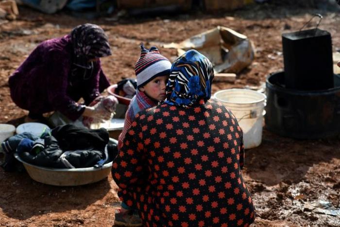 Syrian internally displaced persons (IDPs) are pictured in a camp in Sarmada in the north of Syria's northwestern Idlib province on February 17, 2020.