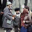 A Romanian soldier with civilians in Bucharest, December 1989