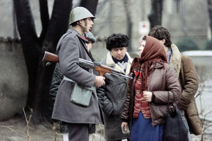 A Romanian soldier with civilians in Bucharest, December 1989