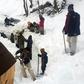 Local residents search for victims of an avalanche that hit the  Neelum Valley in Pakistan-administered Kashmir