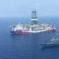 A Turkish navy warship patrols next to Turkey's drilling ship 'Fatih' sent to waters off Cyprus