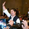 Peruvian politician Keiko Fujimori waves to supporters as she is released from prison in Lima on November 29, 2019