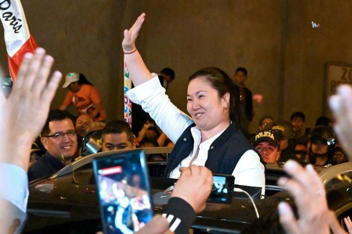 Peruvian politician Keiko Fujimori waves to supporters as she is released from prison in Lima on November 29, 2019