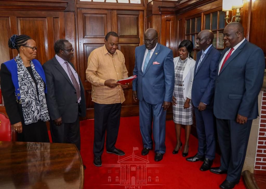 Education CS George Magoha presenting 2019 KCPE Results to President Uhuru Kenyatta.
