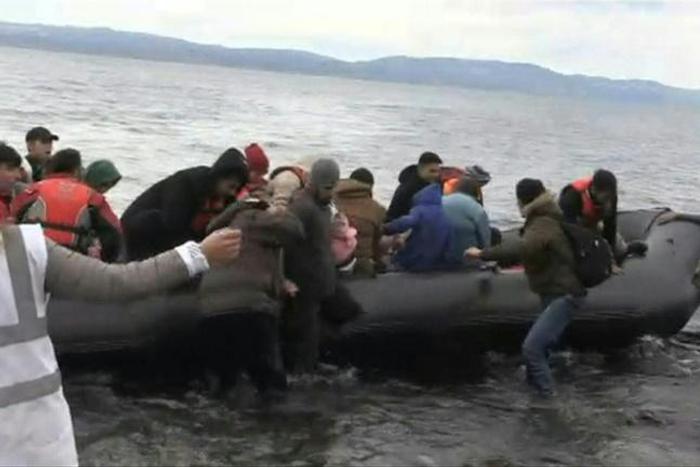 IMAGESMigrants arrive on Lesbos Island from Turkey, after Turkish officials said Ankara would no longer prevent refugees from going to Europe.