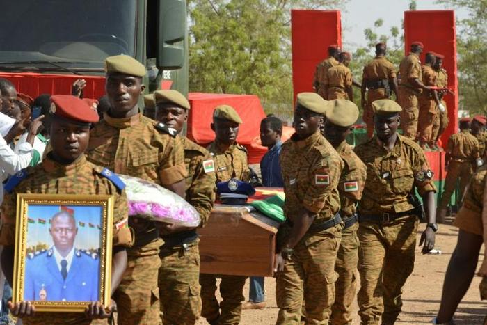 Burkinabe soldiers attend a funeral for eight soldiers killed in twin attacks in the Ouagadougou in March 2018